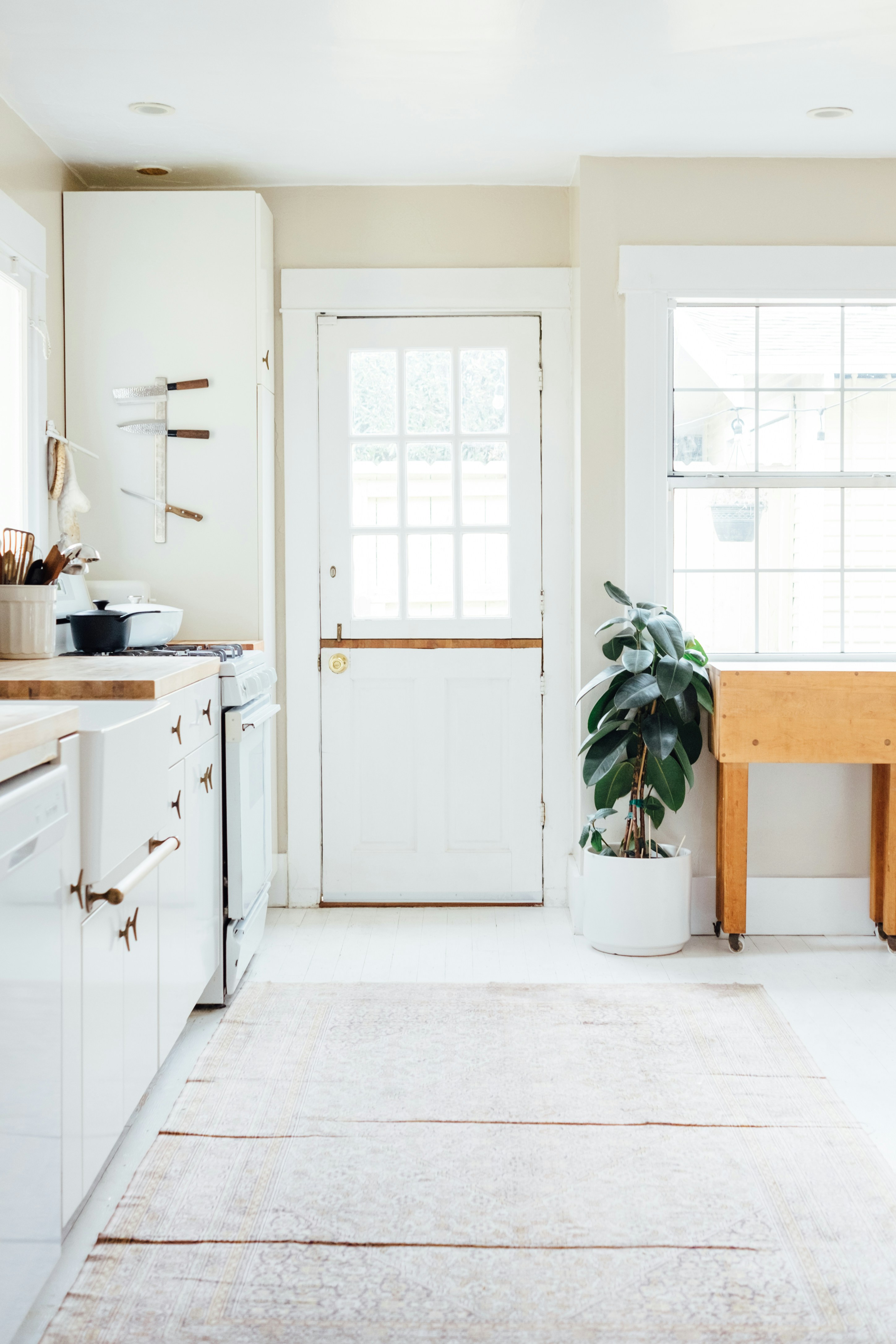 Bright and Minimalist Kitchen Interior with White Cabinets and Wooden Accents